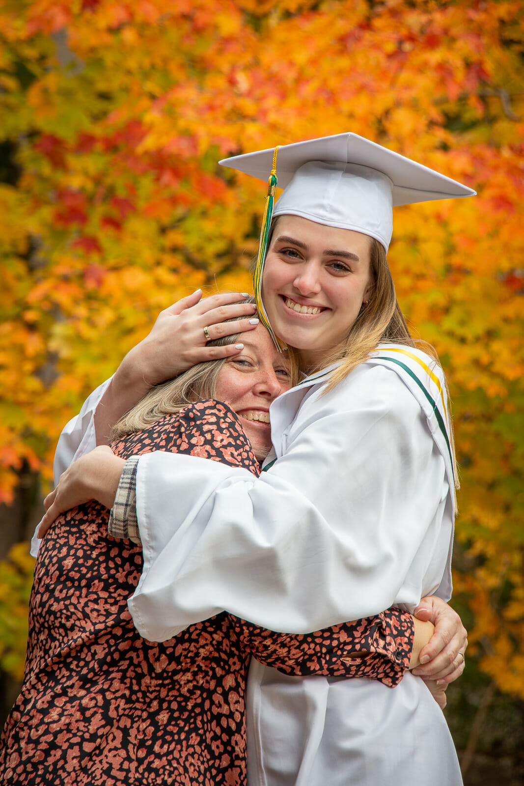 A photo from Jenna Longmire's Graduation session, shot in Acacia Valley Trail in Digby, with family members on a beautiful vibrant fall day