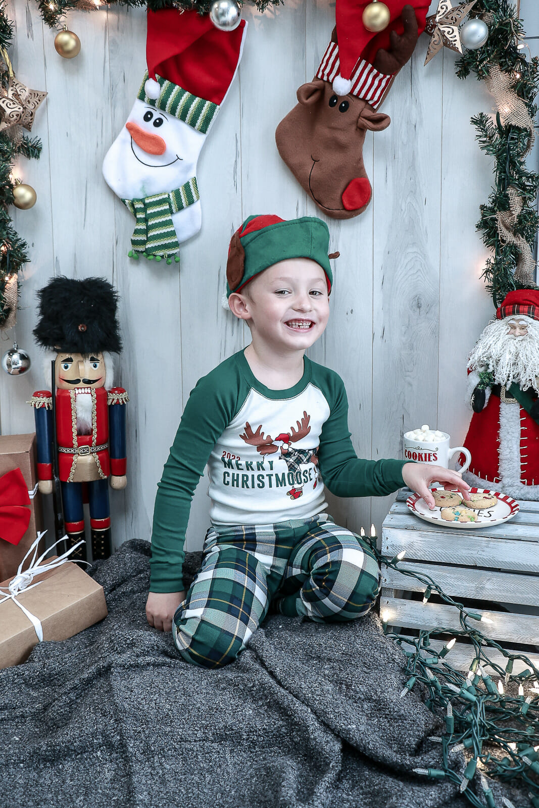 A photo from the Kay Christmas Mini Shoot, shot in Port Wade, Nova Scotia on wintery morning inside with Christmas tree, stockings and nutcrackers.